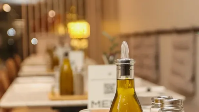 Olive-oil and pepper caddy on a terrazzo table at Eggstatic