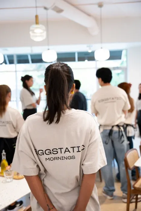 Eggstatic servers in Mornings tees lined up in the dining area