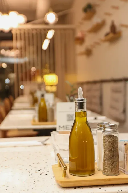 Olive-oil and pepper caddy on a terrazzo table at Eggstatic