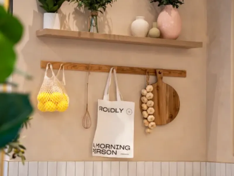 Lemon mesh bag, "Proudly a Morning Person" tote and styled shelf at Eggstatic Oakville