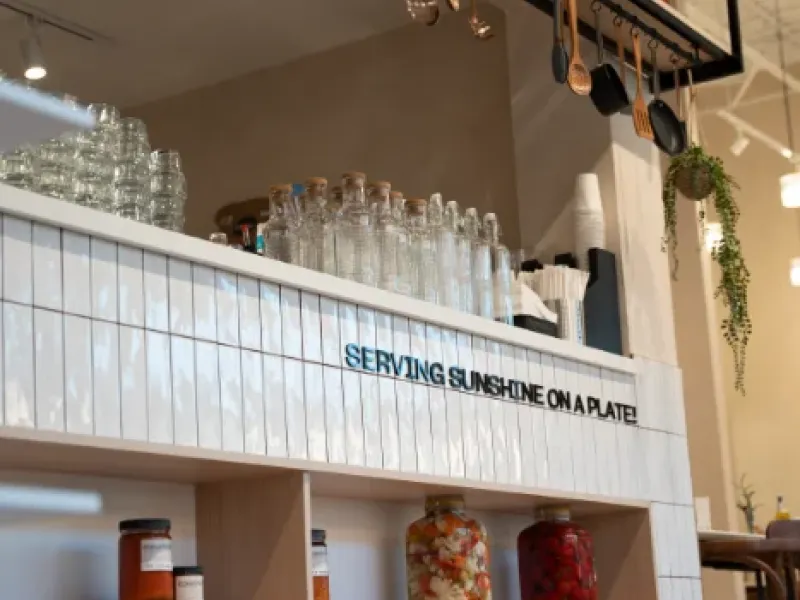"Serving Sunshine on a Plate" tile counter with house-made preserves at Eggstatic Oakville